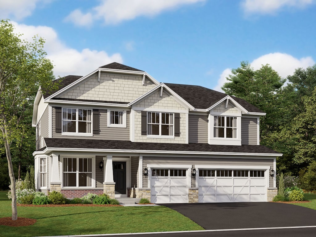 20 Open Pkwy, Hawthorn Woods, IL 60047 - craftsman inspired home with a garage, stone siding, a front lawn, and aphalt driveway