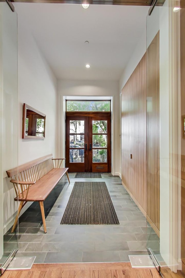 foyer with baseboards, french doors, and recessed lighting