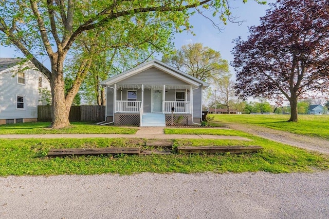800 E Webster St, Clinton, IL 61727 - view of front of home with fence, covered porch, and a front yard