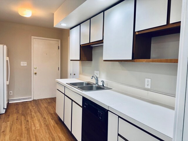 2004 Bruce Dr Unit 1, Urbana, IL 61801 - kitchen with dishwasher, a sink, freestanding refrigerator, light countertops, and white cabinets