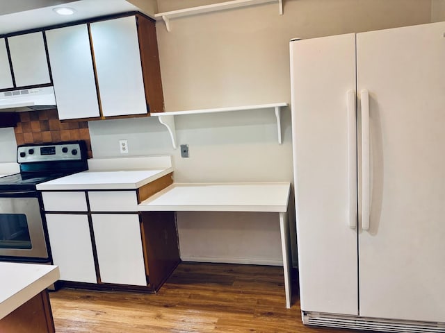 2004 Bruce Dr Unit 1, Urbana, IL 61801 - kitchen featuring freestanding refrigerator, under cabinet range hood, stainless steel electric stove, light countertops, and white cabinetry