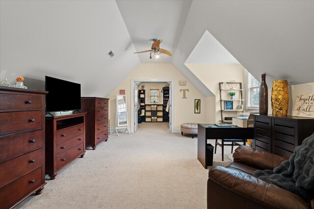 bedroom with visible vents, vaulted ceiling, and light carpet