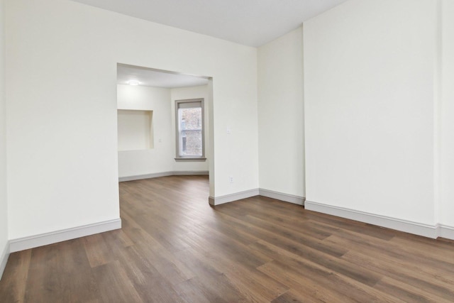 1752 E 72nd Pl, Chicago, IL 60649 - empty room with dark wood finished floors and baseboards