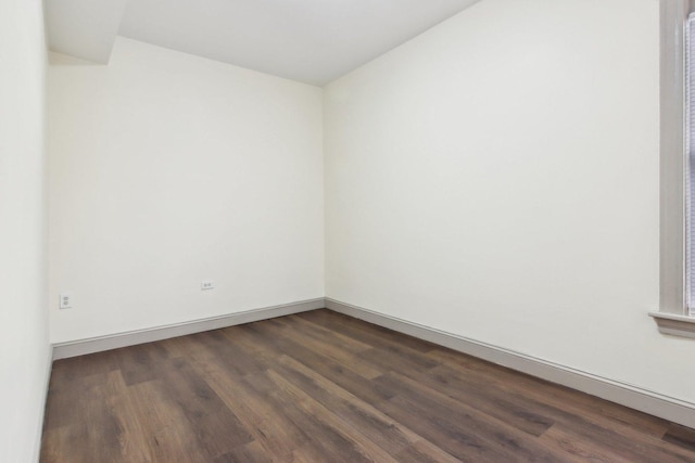 1752 E 72nd Pl, Chicago, IL 60649 - empty room with dark wood finished floors and baseboards