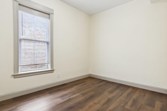 1752 E 72nd Pl, Chicago, IL 60649 - empty room with dark wood-style floors and baseboards