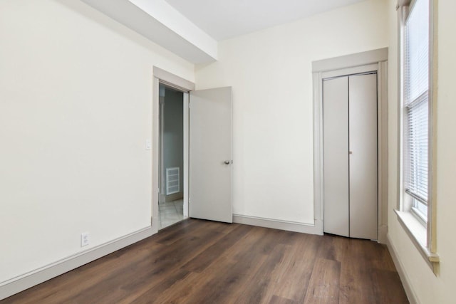 1752 E 72nd Pl, Chicago, IL 60649 - unfurnished bedroom featuring wood finished floors and a closet