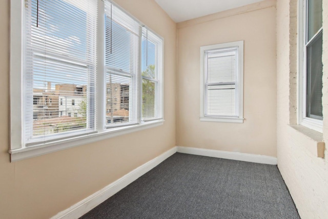 1752 E 72nd Pl, Chicago, IL 60649 - spare room with dark carpet and baseboards