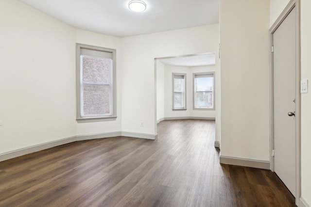 1752 E 72nd Pl, Chicago, IL 60649 - spare room with dark wood-style floors and baseboards