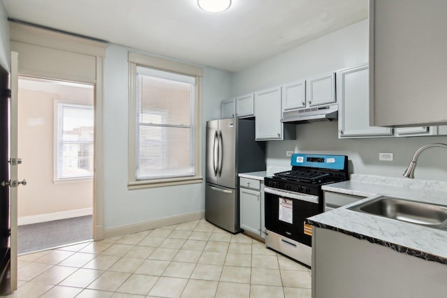1752 E 72nd Pl, Chicago, IL 60649 - kitchen featuring stainless steel appliances, under cabinet range hood, a sink, and baseboards