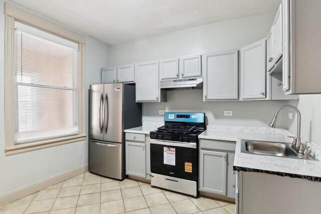 1752 E 72nd Pl, Chicago, IL 60649 - kitchen featuring appliances with stainless steel finishes, under cabinet range hood, a sink, gray cabinets, and light tile patterned floors