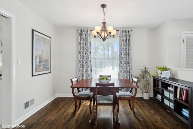 dining room featuring baseboards, a notable chandelier, dark wood finished floors, and visible vents