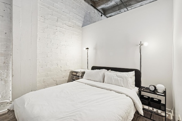 bedroom with wood finished floors