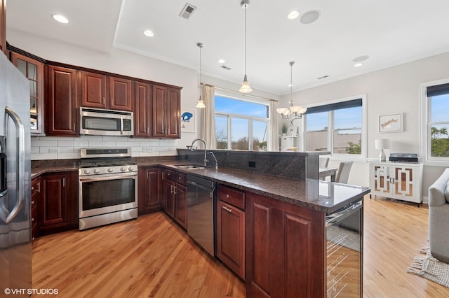 1717 W Newport Ave Unit 5, Chicago, IL 60657 - kitchen with appliances with stainless steel finishes, wine cooler, light wood-style flooring, plenty of natural light, and ornamental molding
