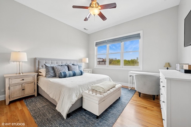 1717 W Newport Ave Unit 5, Chicago, IL 60657 - bedroom with light wood-style flooring, a ceiling fan, and a desk