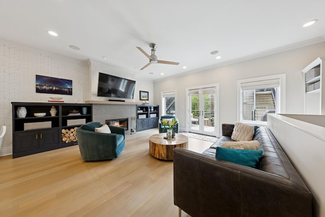 1924 N Wolcott Ave, Chicago, IL 60622 - living room with ornamental molding, light wood-style flooring, ceiling fan, a fireplace, and recessed lighting