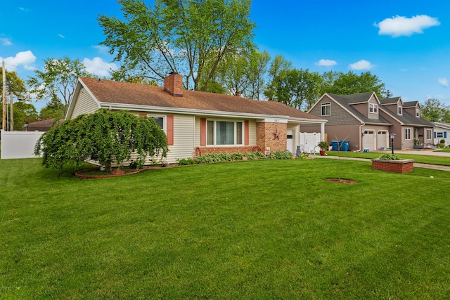 503 E Cedar Ln, Monticello, IL 61856 - view of front facade featuring a garage and a chimney