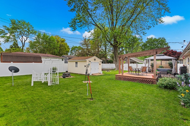 503 E Cedar Ln, Monticello, IL 61856 - view of yard with a gazebo, a fire pit, a deck, a shed, and an outdoor structure