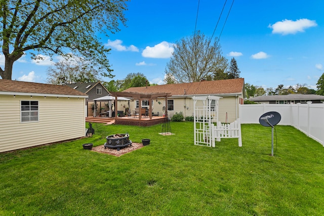 503 E Cedar Ln, Monticello, IL 61856 - back of house with a fire pit, a pergola, a deck, a gazebo, and an outbuilding
