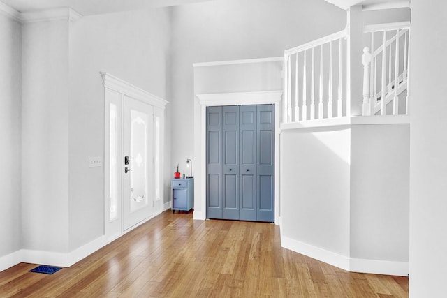 118 Jack Dylan Dr, Hampshire, IL 60140 - entryway featuring baseboards, wood finished floors, and a high ceiling