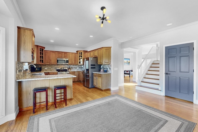 118 Jack Dylan Dr, Hampshire, IL 60140 - kitchen featuring backsplash, a sink, a peninsula, glass insert cabinets, and stainless steel appliances