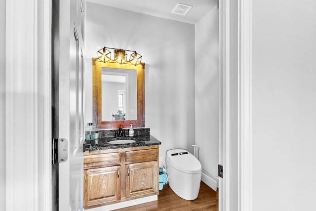 118 Jack Dylan Dr, Hampshire, IL 60140 - half bath featuring visible vents, wood finished floors, toilet, and vanity