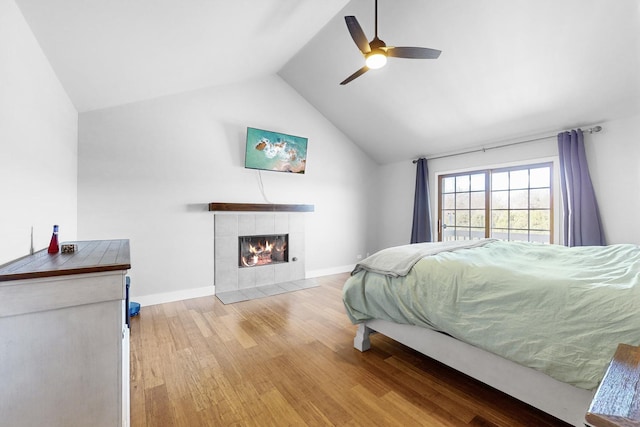 118 Jack Dylan Dr, Hampshire, IL 60140 - bedroom featuring ceiling fan, a tiled fireplace, baseboards, wood finished floors, and lofted ceiling