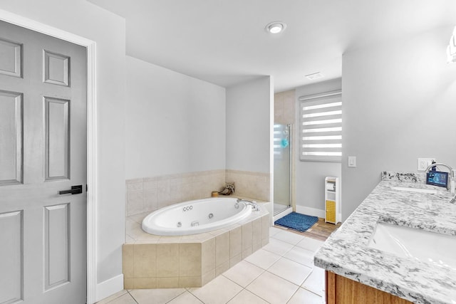 118 Jack Dylan Dr, Hampshire, IL 60140 - full bath with a jetted tub, a stall shower, a sink, tile patterned floors, and baseboards