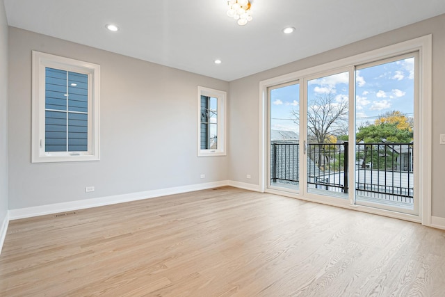 unfurnished room with baseboards, recessed lighting, and light wood finished floors
