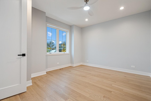 spare room with a ceiling fan, baseboards, recessed lighting, and light wood-type flooring