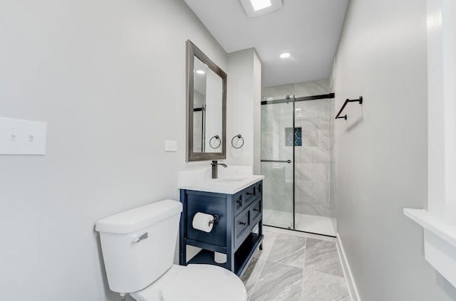 full bath featuring a stall shower, vanity, baseboards, toilet, and marble finish floor