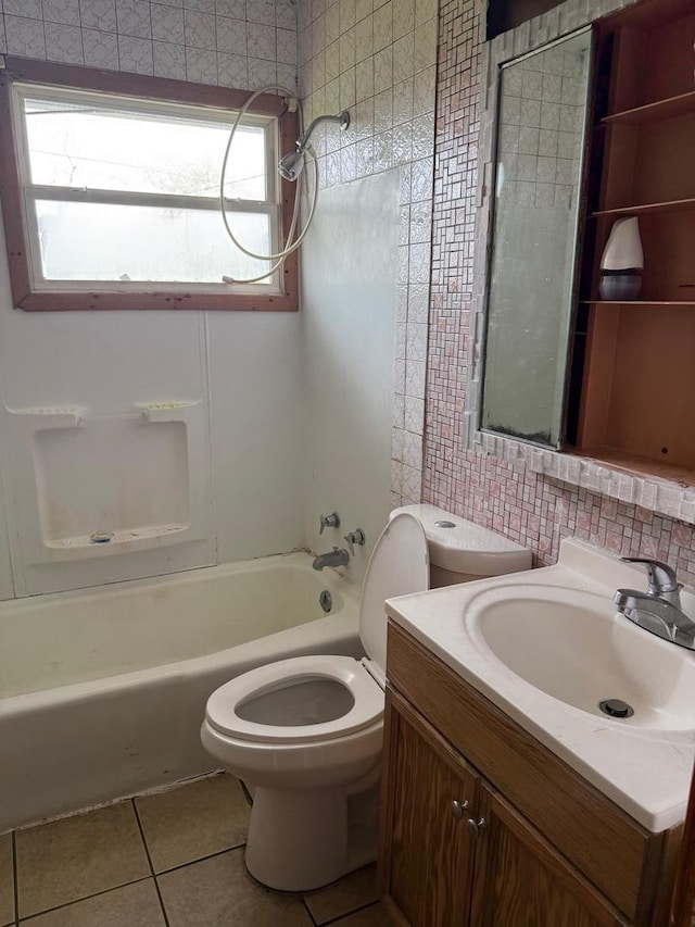 full bath featuring vanity, toilet, tile patterned floors, tile walls, and bathing tub / shower combination