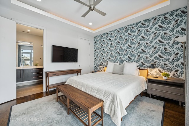 2109 N Campbell Ave Unit 2N, Chicago, IL 60647 - bedroom featuring wood finished floors, recessed lighting, a tray ceiling, connected bathroom, and a ceiling fan