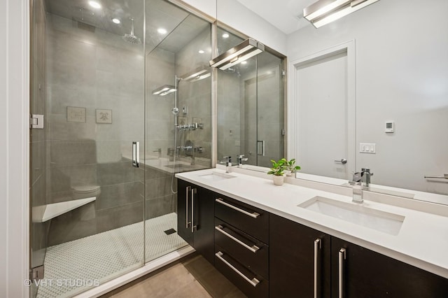 2109 N Campbell Ave Unit 2N, Chicago, IL 60647 - bathroom featuring a stall shower, double vanity, tile patterned floors, and recessed lighting