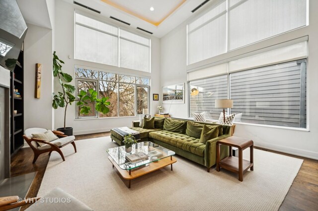 2109 N Campbell Ave Unit 2N, Chicago, IL 60647 - living room featuring wood finished floors, a high ceiling, baseboards, and recessed lighting