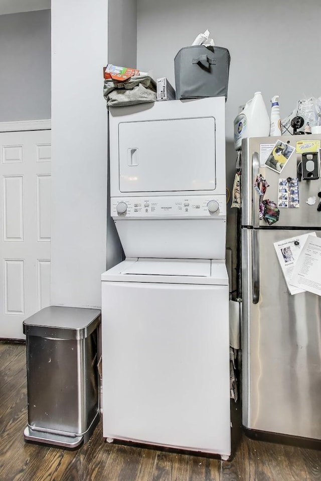 2437 W Taylor St, Chicago, IL 60612 - laundry area with stacked washer and clothes dryer and wood finished floors