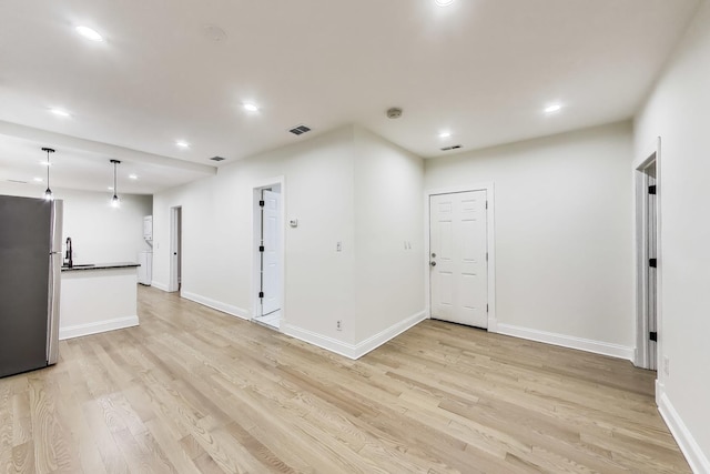 2437 W Taylor St, Chicago, IL 60612 - unfurnished living room with light wood-style flooring and recessed lighting