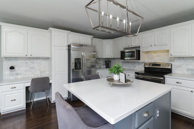 kitchen with stainless steel appliances and white cabinetry