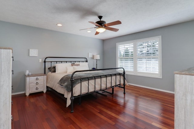 bedroom with baseboards, recessed lighting, ceiling fan, and wood finished floors