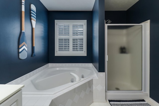 full bath with vanity, a stall shower, and a bath