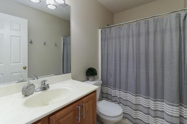 full bath featuring toilet and vanity