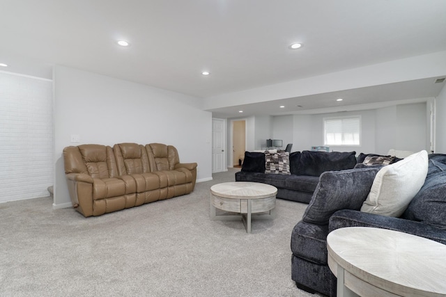 living room featuring recessed lighting, visible vents, and light carpet