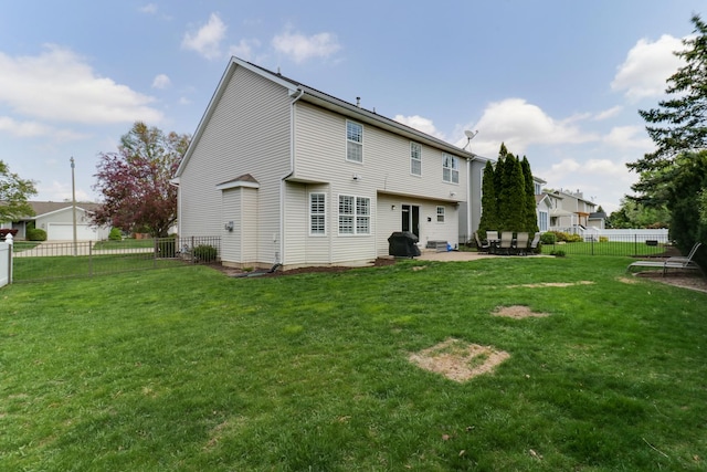 rear view of house with a fenced backyard, a patio, and a yard