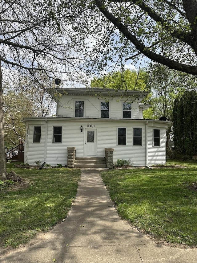 view of front of home with a front yard