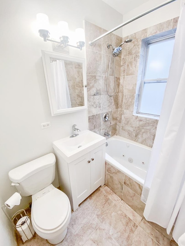 full bath featuring vanity, a combined bath / shower with jetted tub, and toilet