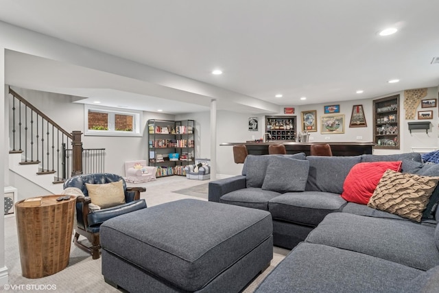 living area with visible vents, light colored carpet, stairs, a bar, and recessed lighting