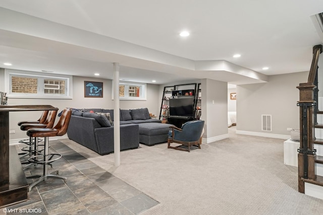 carpeted living area with visible vents, recessed lighting, and baseboards
