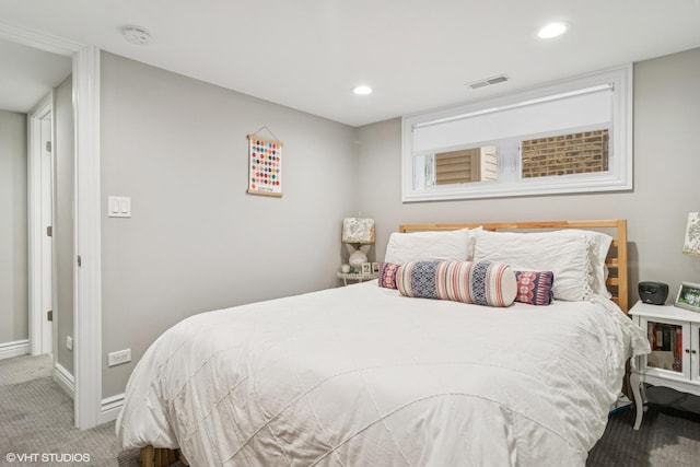 carpeted bedroom featuring baseboards, recessed lighting, and visible vents
