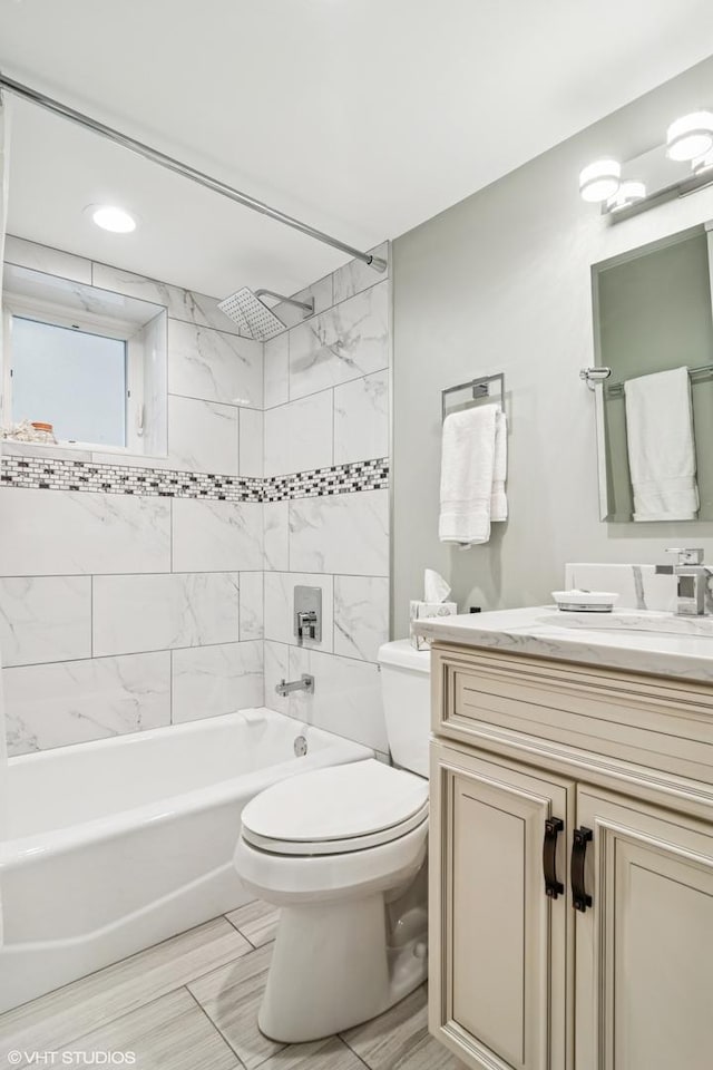 full bathroom featuring toilet,  shower combination, and vanity