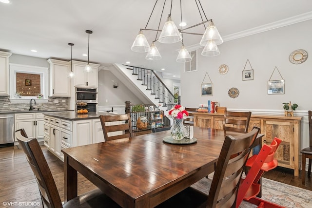 dining space with dark wood-style flooring, visible vents, crown molding, stairway, and recessed lighting
