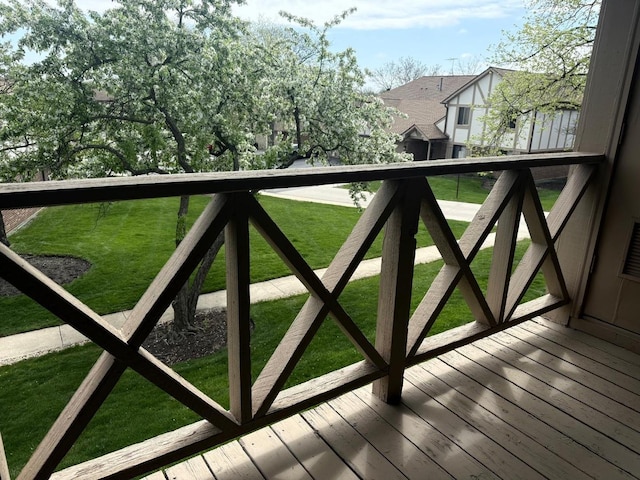 view of gate with a lawn